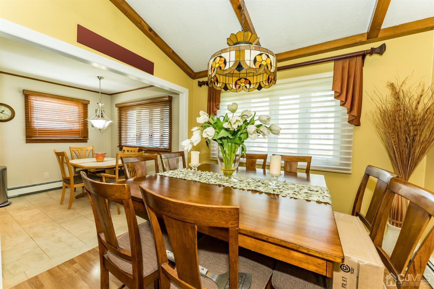 41 Trafalgar Drive Colonia, NJ 07067 - Photo 11 of 40 a view of a dining room with furniture and a chandelier
