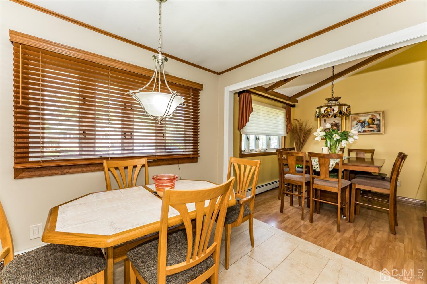 41 Trafalgar Drive Colonia, NJ 07067 - Photo 15 of 40 a dining room with furniture and wooden floor