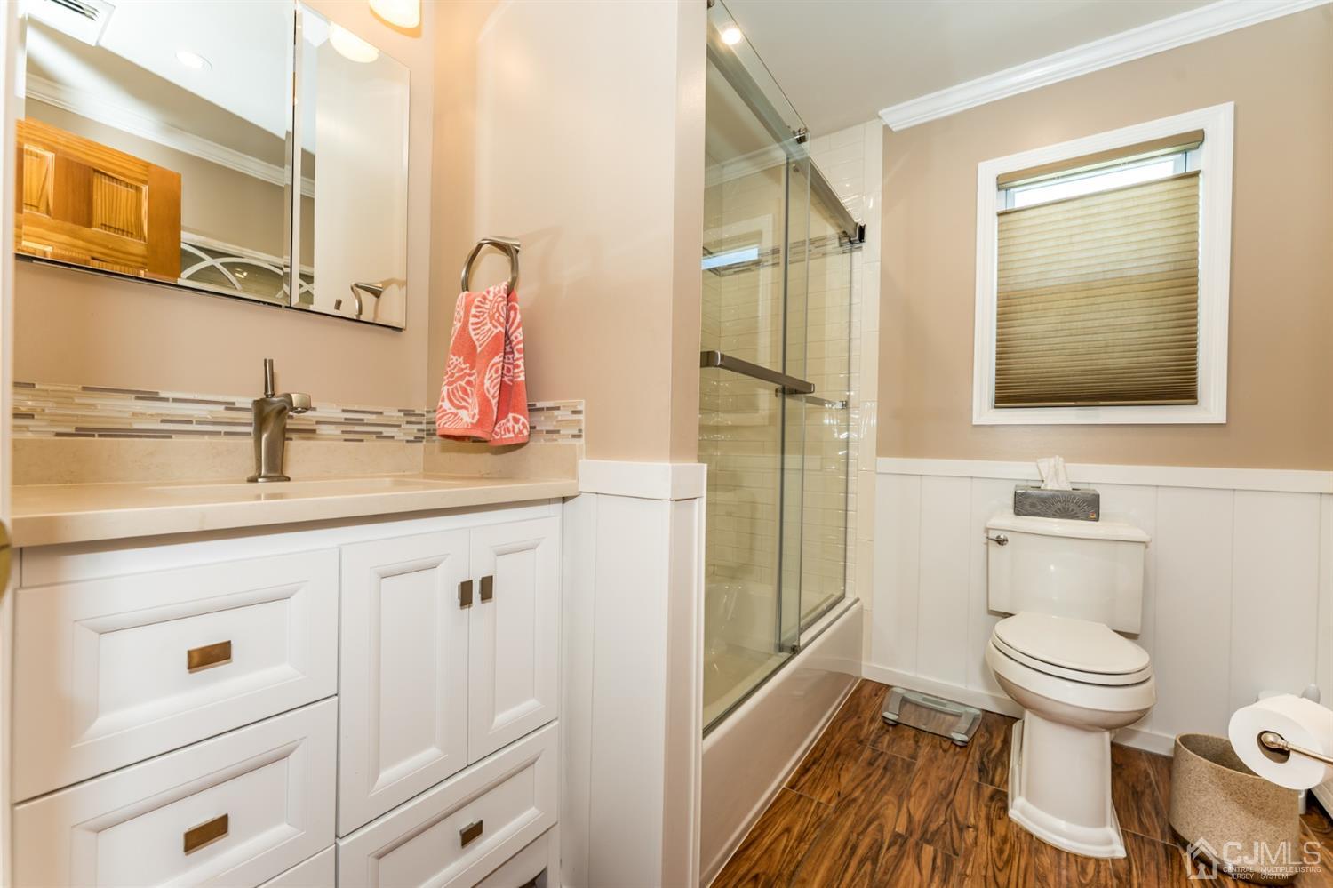 41 Trafalgar Drive Colonia, NJ 07067 - Photo 16 of 40 a bathroom with a sink a toilet and shower