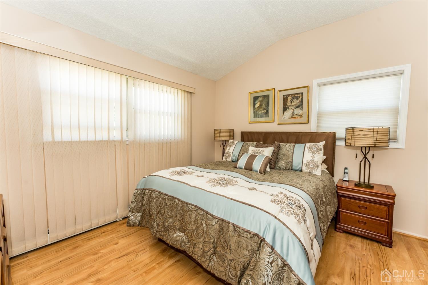 41 Trafalgar Drive Colonia, NJ 07067 - Photo 17 of 40 a bedroom with a bed and wooden floor