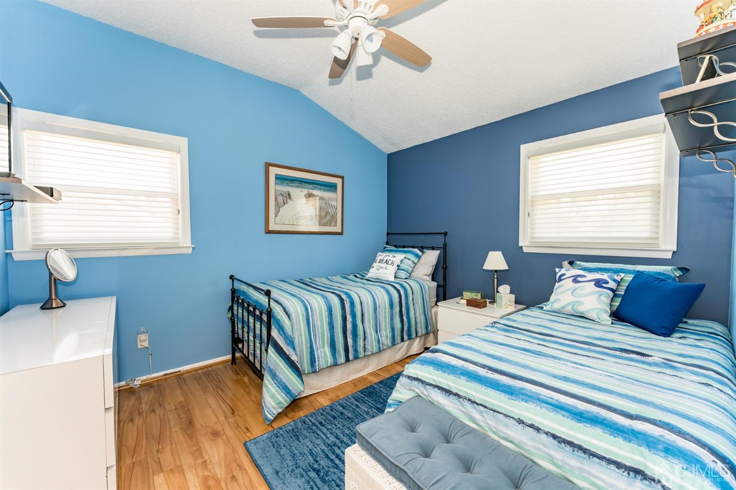 41 Trafalgar Drive Colonia, NJ 07067 - Photo 20 of 40 a bedroom with two beds and a chandelier