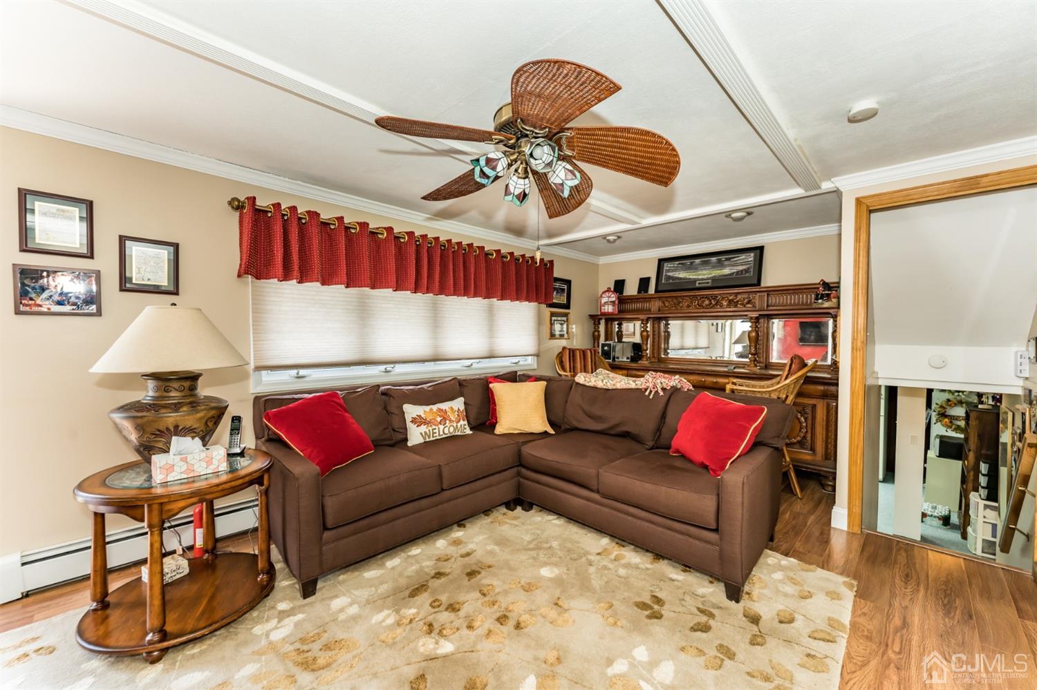 41 Trafalgar Drive Colonia, NJ 07067 - Photo 3 of 40 a living room with furniture a couch and a chandelier