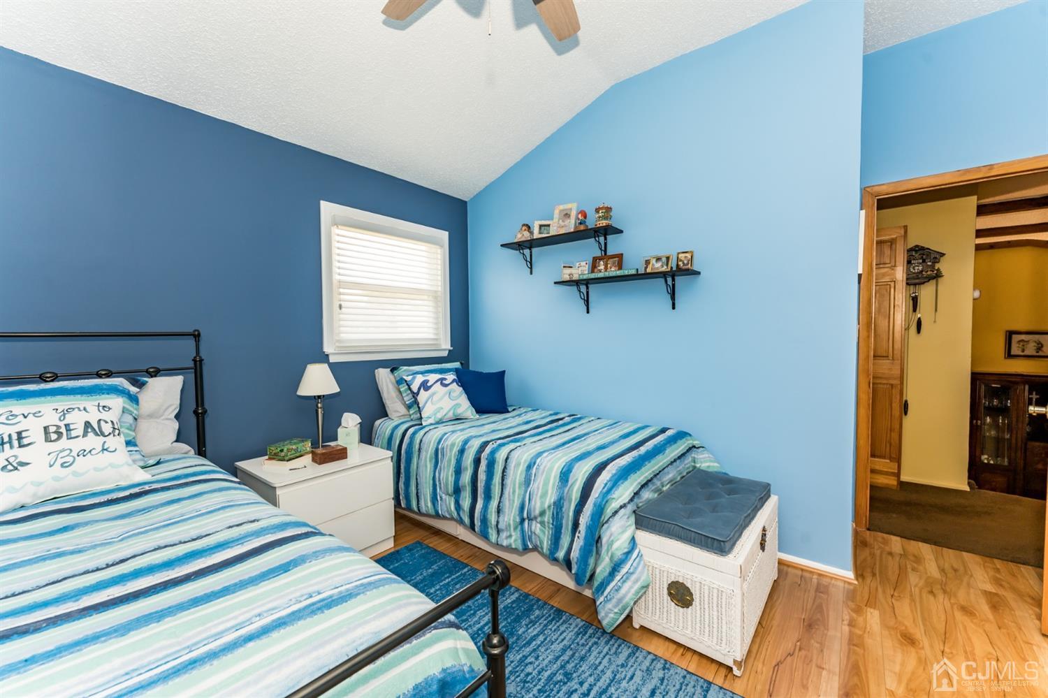 41 Trafalgar Drive Colonia, NJ 07067 - Photo 21 of 40 a bedroom with a bed and wooden floor