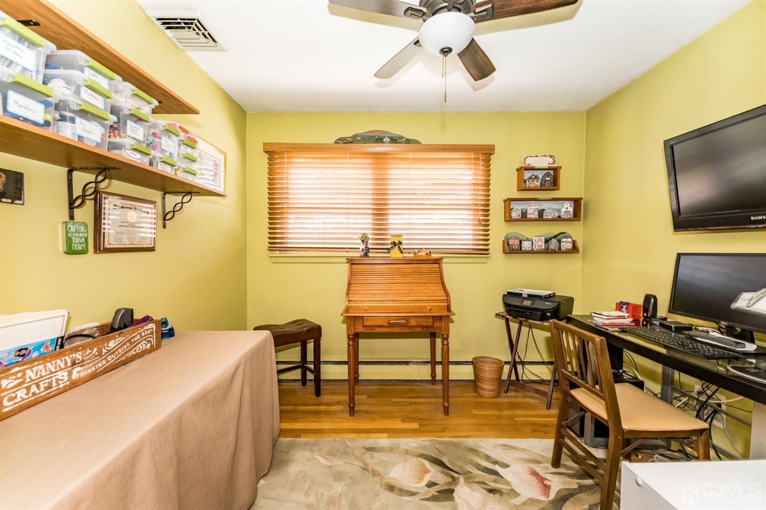 41 Trafalgar Drive Colonia, NJ 07067 - Photo 22 of 40 a room with gym equipment and a large window