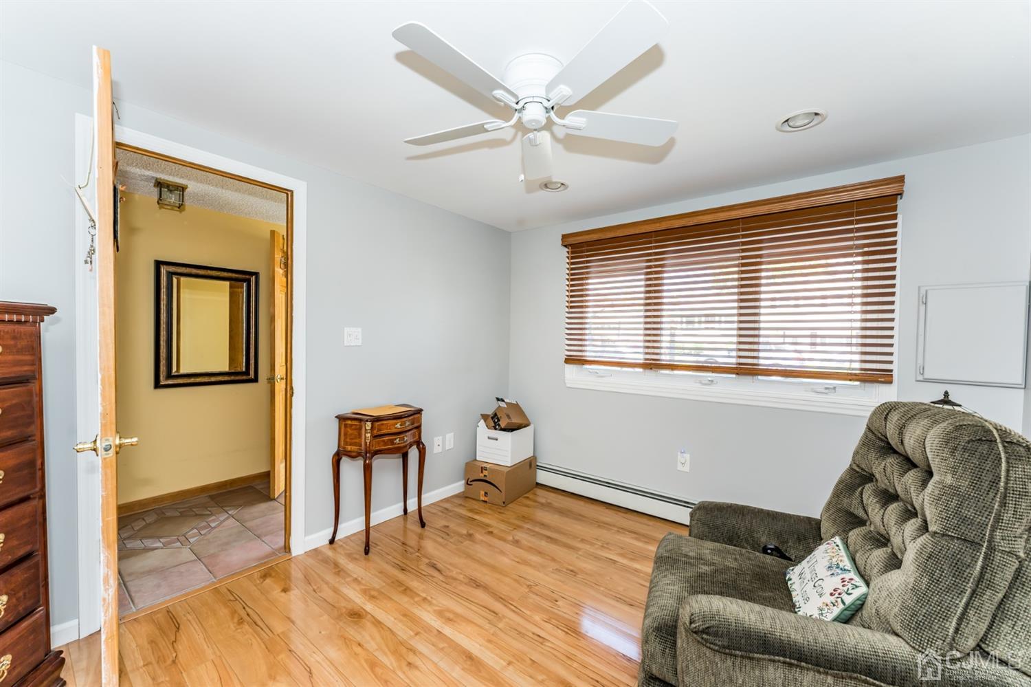 41 Trafalgar Drive Colonia, NJ 07067 - Photo 26 of 40 a bedroom with a bed and wooden floor