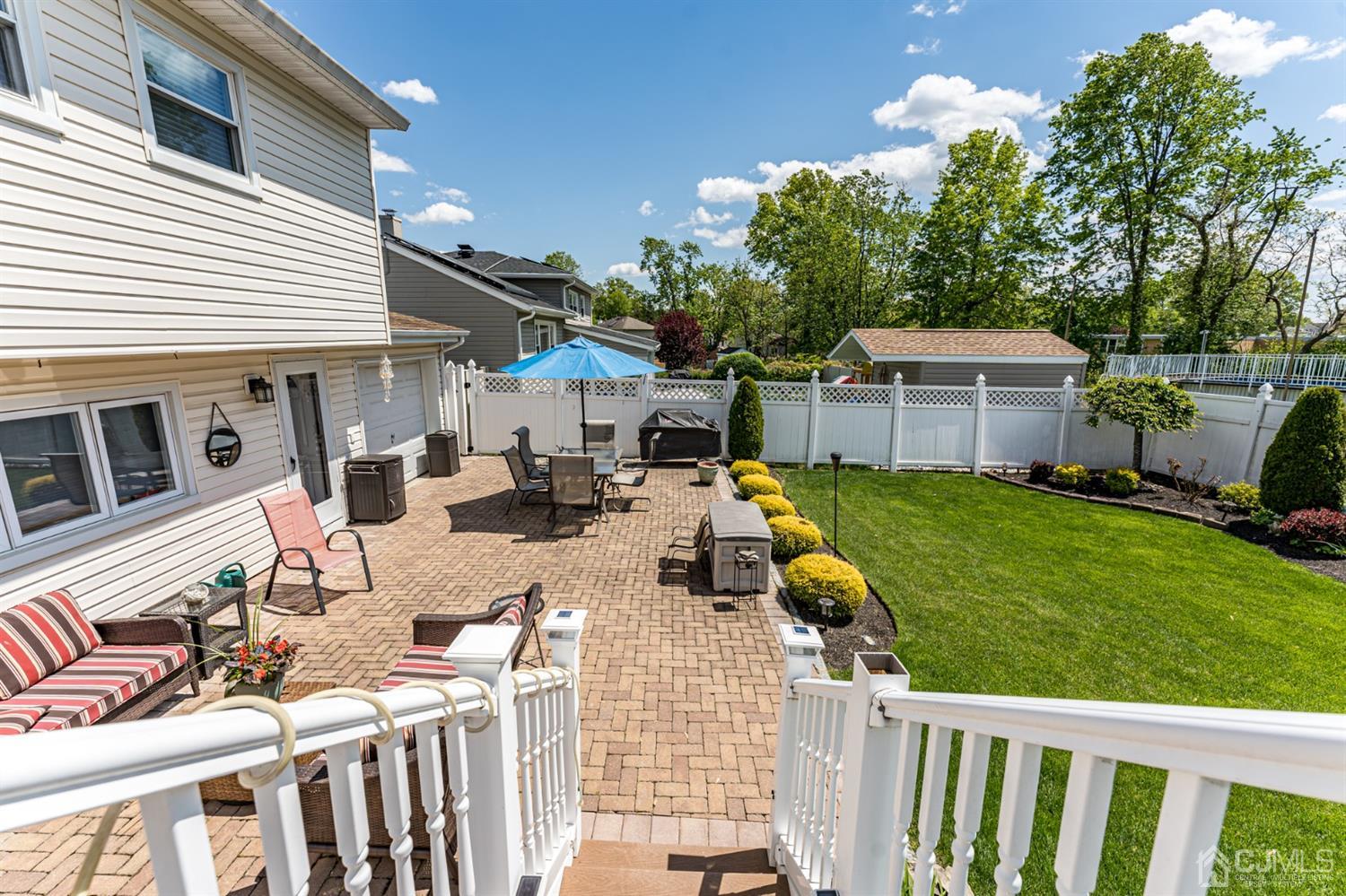 41 Trafalgar Drive Colonia, NJ 07067 - Photo 34 of 40 a view of a patio with chairs and a yard