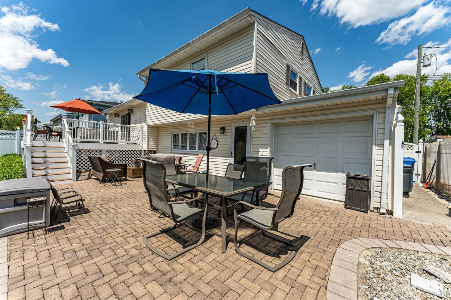 41 Trafalgar Drive Colonia, NJ 07067 - Photo 35 of 40 a view of a patio with a table and chairs under an umbrella