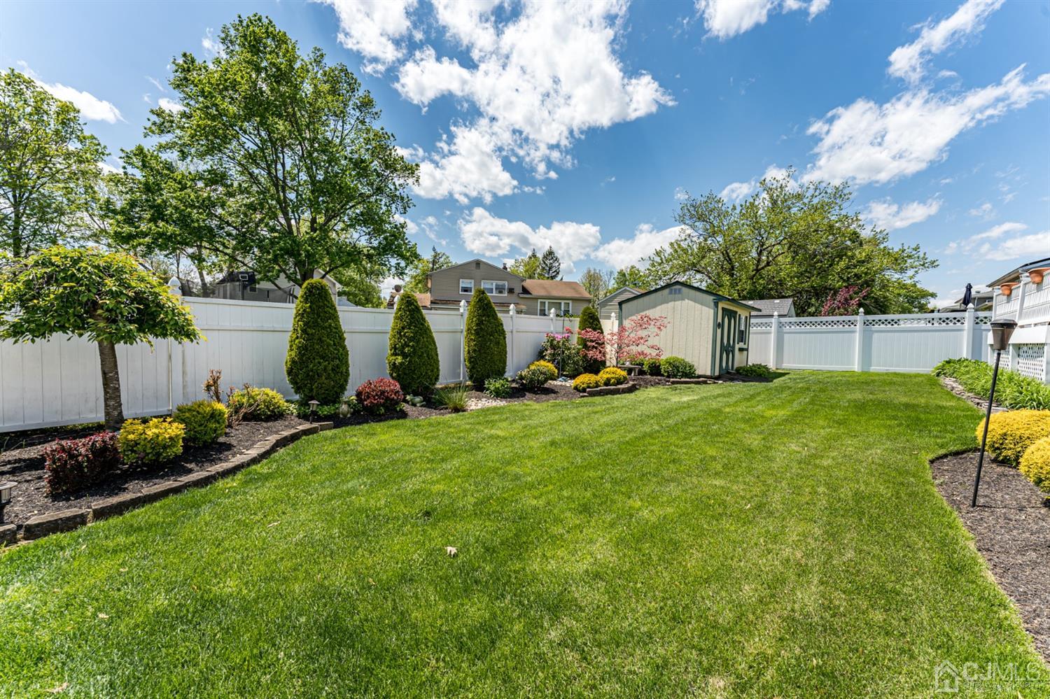 41 Trafalgar Drive Colonia, NJ 07067 - Photo 38 of 40 a view of backyard of house with green space