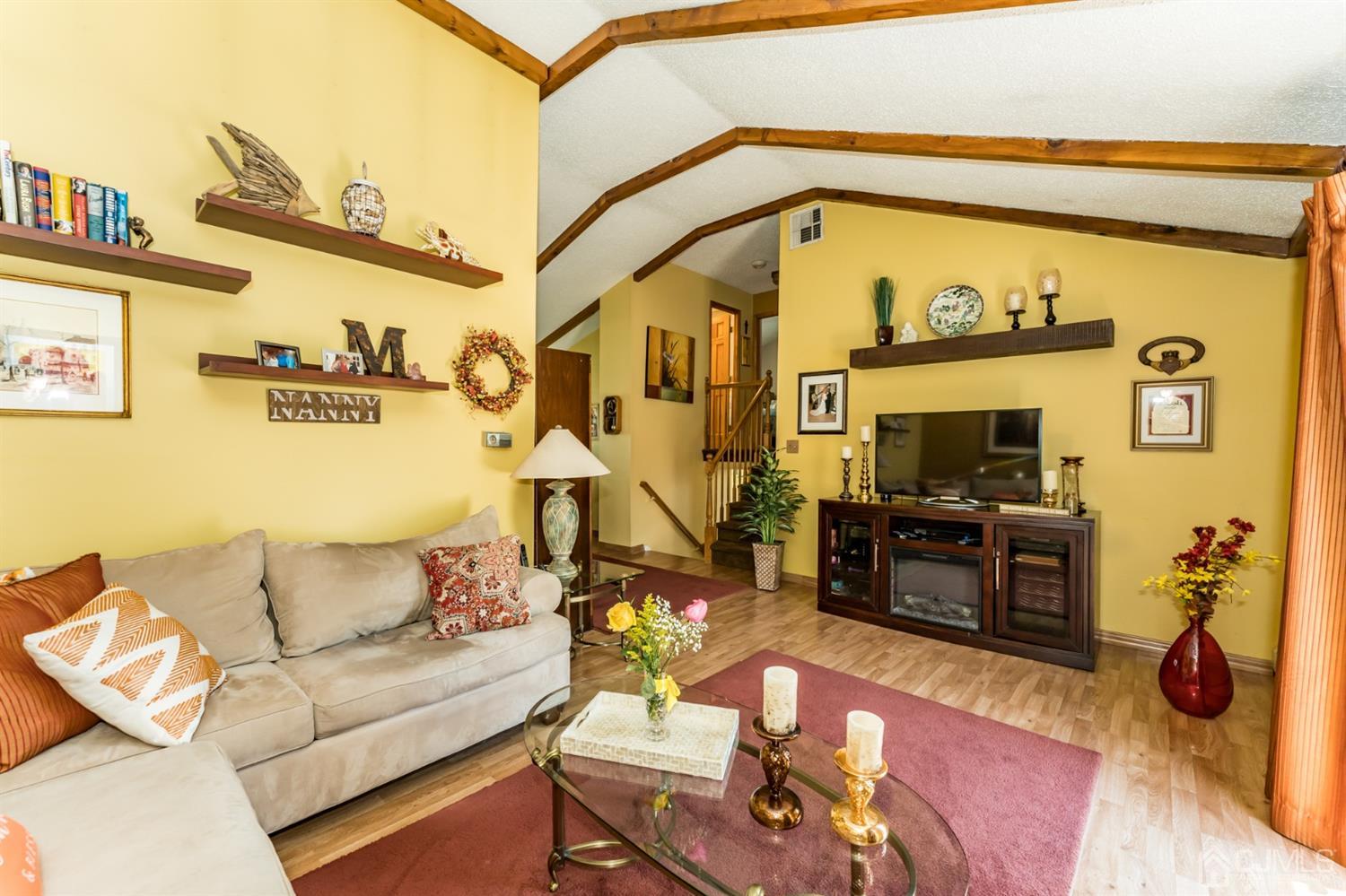 41 Trafalgar Drive Colonia, NJ 07067 - Photo 6 of 40 a living room with furniture and a flat screen tv