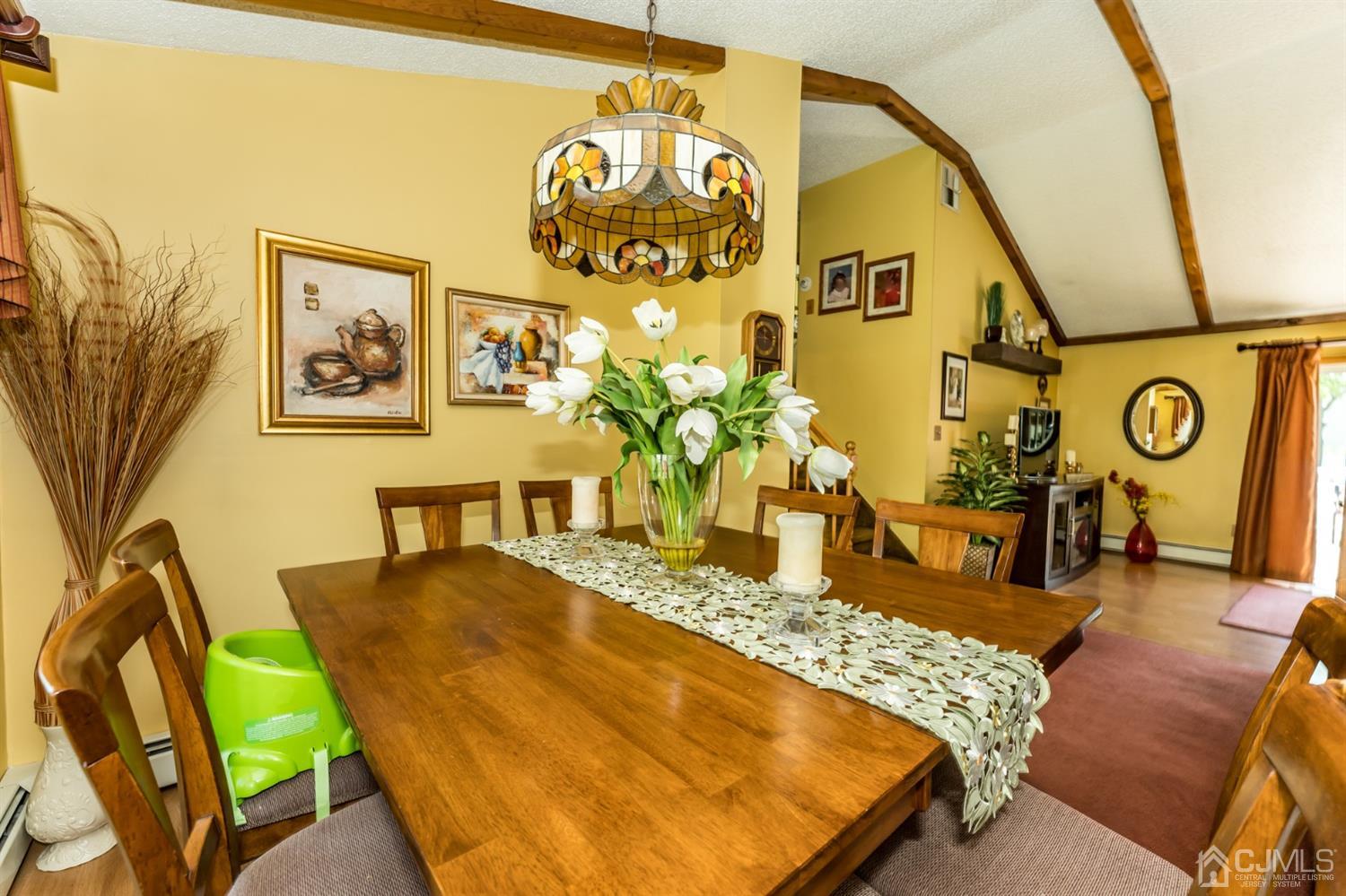 41 Trafalgar Drive Colonia, NJ 07067 - Photo 9 of 40 a view of a dining room with furniture and a chandelier