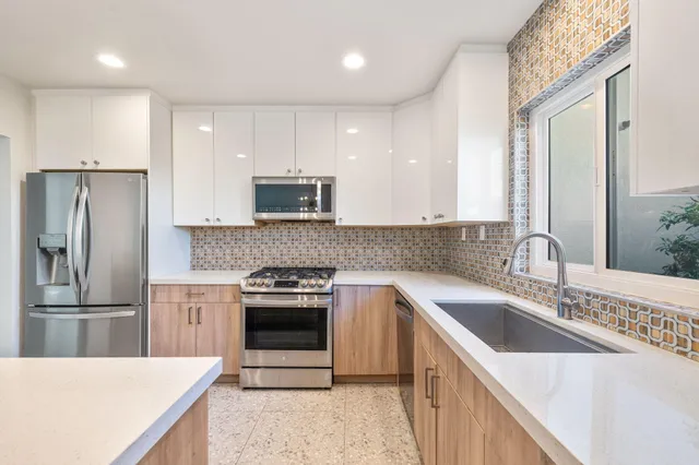 a spacious bathroom with a shower curtain and a sink