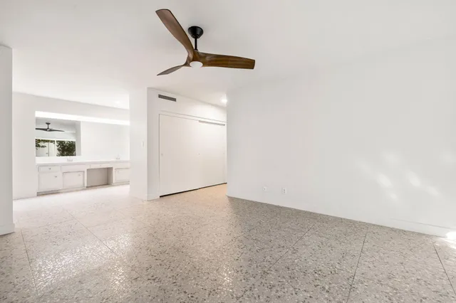 a view of a room with large windows