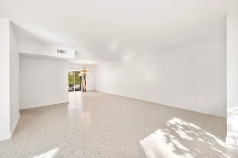 a view of a chair and table in the patio