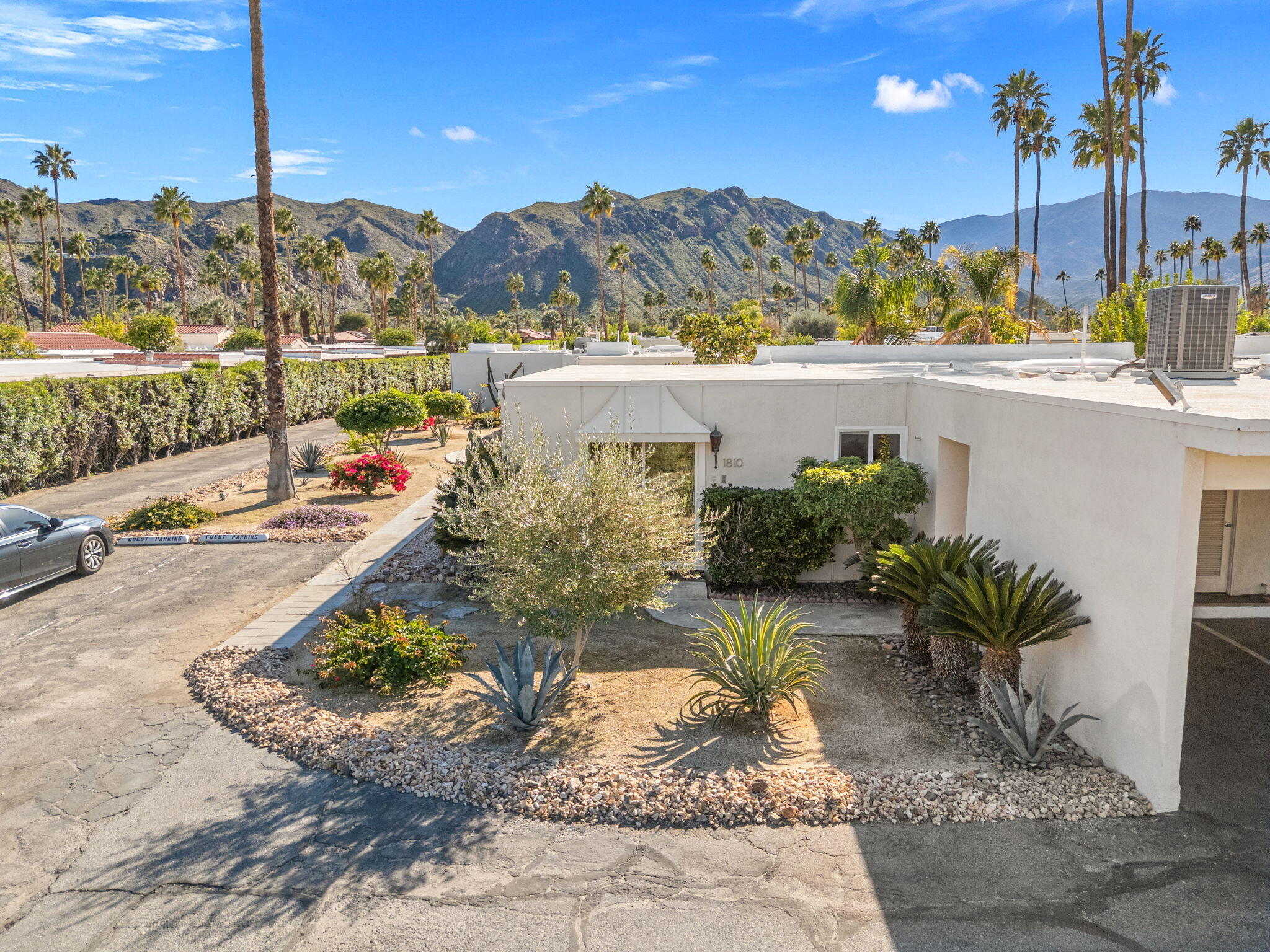 1810 Sandcliff Road Palm Springs, CA 92264 - Photo 3 of 55 a view of a terrace with a garden and mountain view