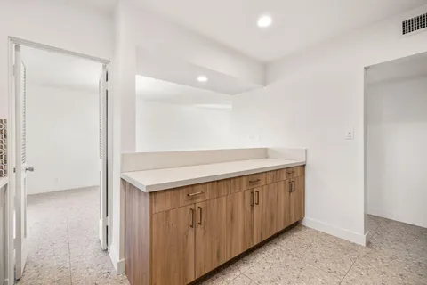 a view of a backyard and swimming pool