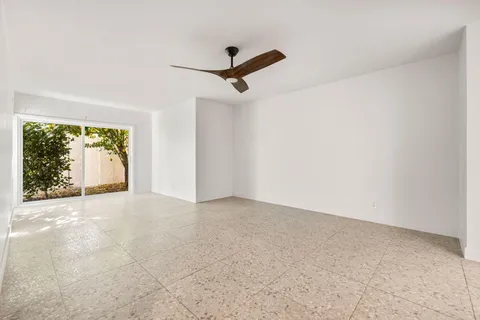 a view of a kitchen and a kitchen with a sink cabinets