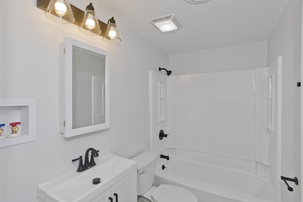 118 Keddy Street Springfield, MA 01109 - Photo 13 of 19 a bathroom with a sink a toilet and shower