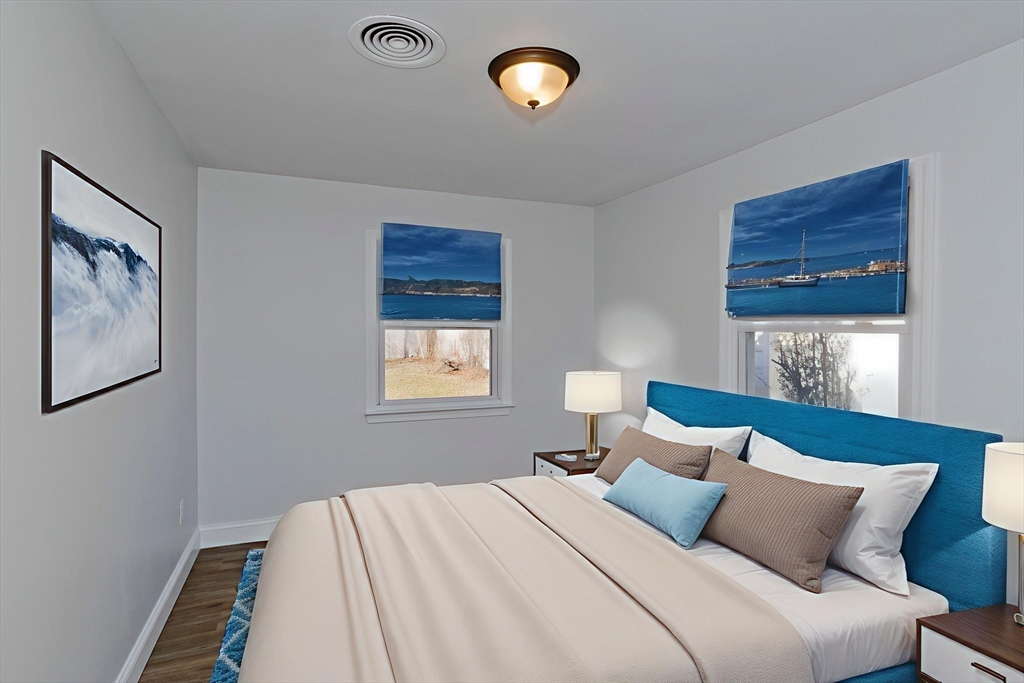 118 Keddy Street Springfield, MA 01109 - Photo 14 of 19 a bedroom with a bed and a window