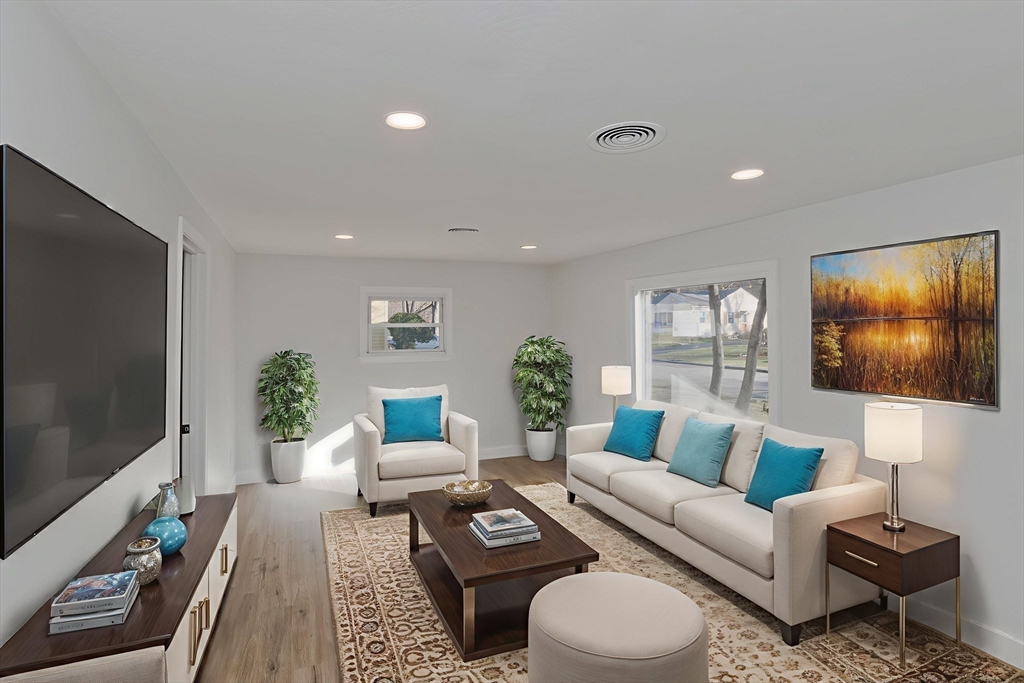 118 Keddy Street Springfield, MA 01109 - Photo 6 of 19 a living room with furniture and a flat screen tv