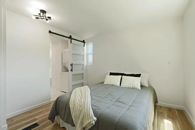 a bedroom with a bed and a table