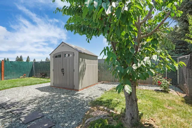 a house with trees in the background