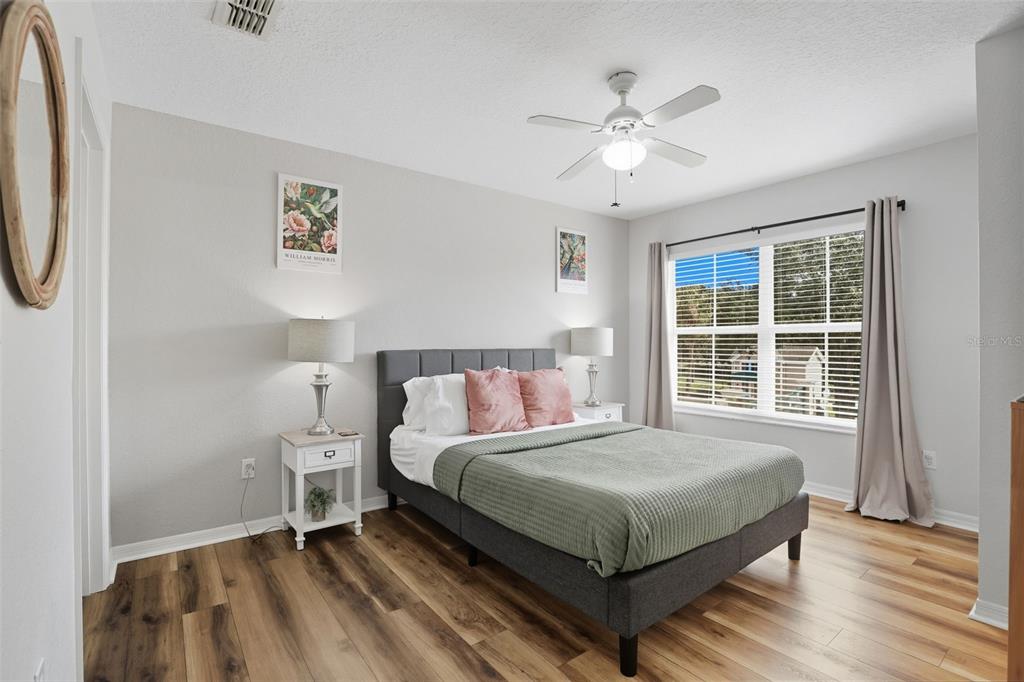 2606 Lodi Circle, Unit 102 Kissimmee, FL 34746 - Photo 19 of 37 a bedroom with a bed and a window