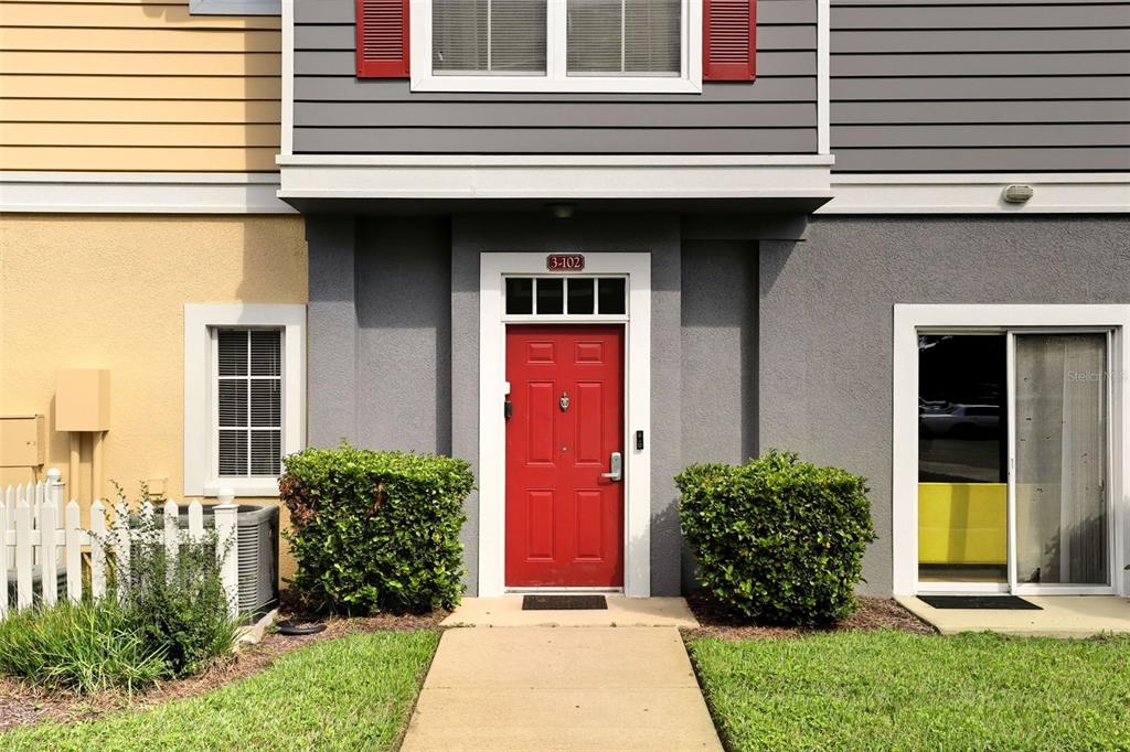 2606 Lodi Circle, Unit 102 Kissimmee, FL 34746 - Photo 2 of 37 a view of a entryway door front of house