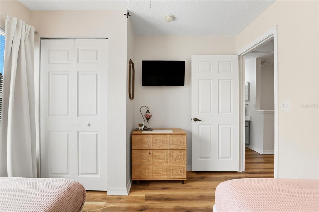 2606 Lodi Circle, Unit 102 Kissimmee, FL 34746 - Photo 26 of 37 a living room with furniture and a flat screen tv