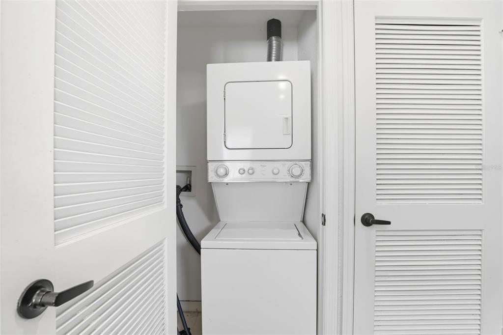 2606 Lodi Circle, Unit 102 Kissimmee, FL 34746 - Photo 27 of 37 a utility room with dryer and washer