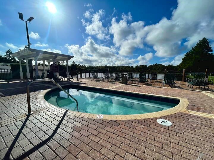 2606 Lodi Circle, Unit 102 Kissimmee, FL 34746 - Photo 28 of 37 a view of a swimming pool with a patio