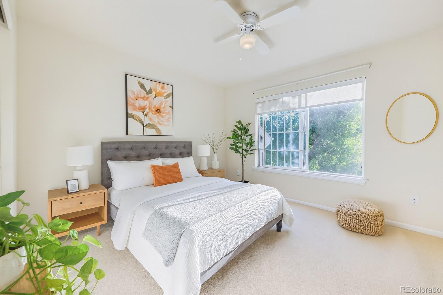 13867 Fillmore Street Thornton, CO 80602 - Photo 20 of 24 a bedroom with a bed painting on wall and a large window