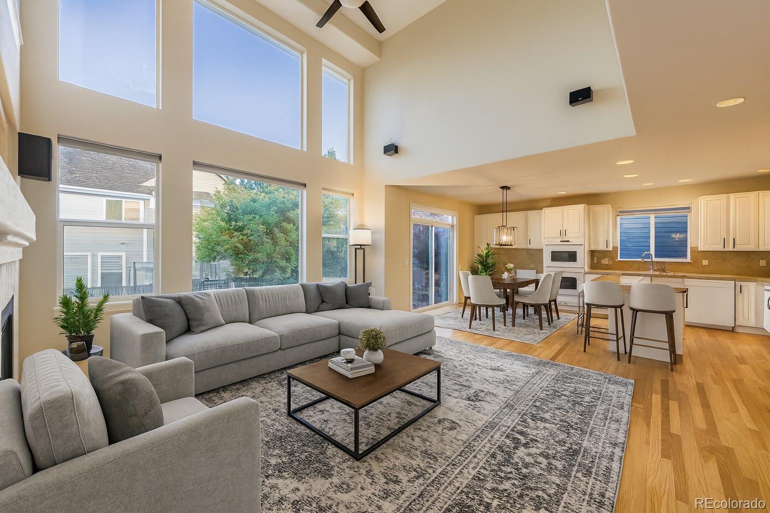 13867 Fillmore Street Thornton, CO 80602 - Photo 2 of 24 a living room with furniture and a large window