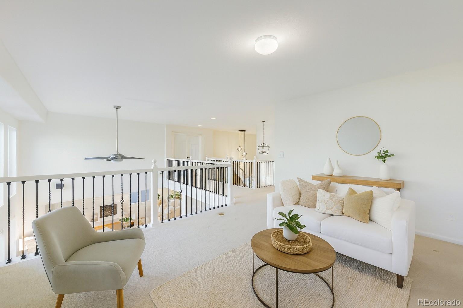 13867 Fillmore Street Thornton, CO 80602 - Photo 6 of 24 a living room with furniture and a table