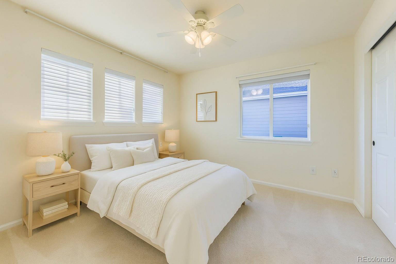 13867 Fillmore Street Thornton, CO 80602 - Photo 10 of 24 a bedroom with a bed and a chandelier