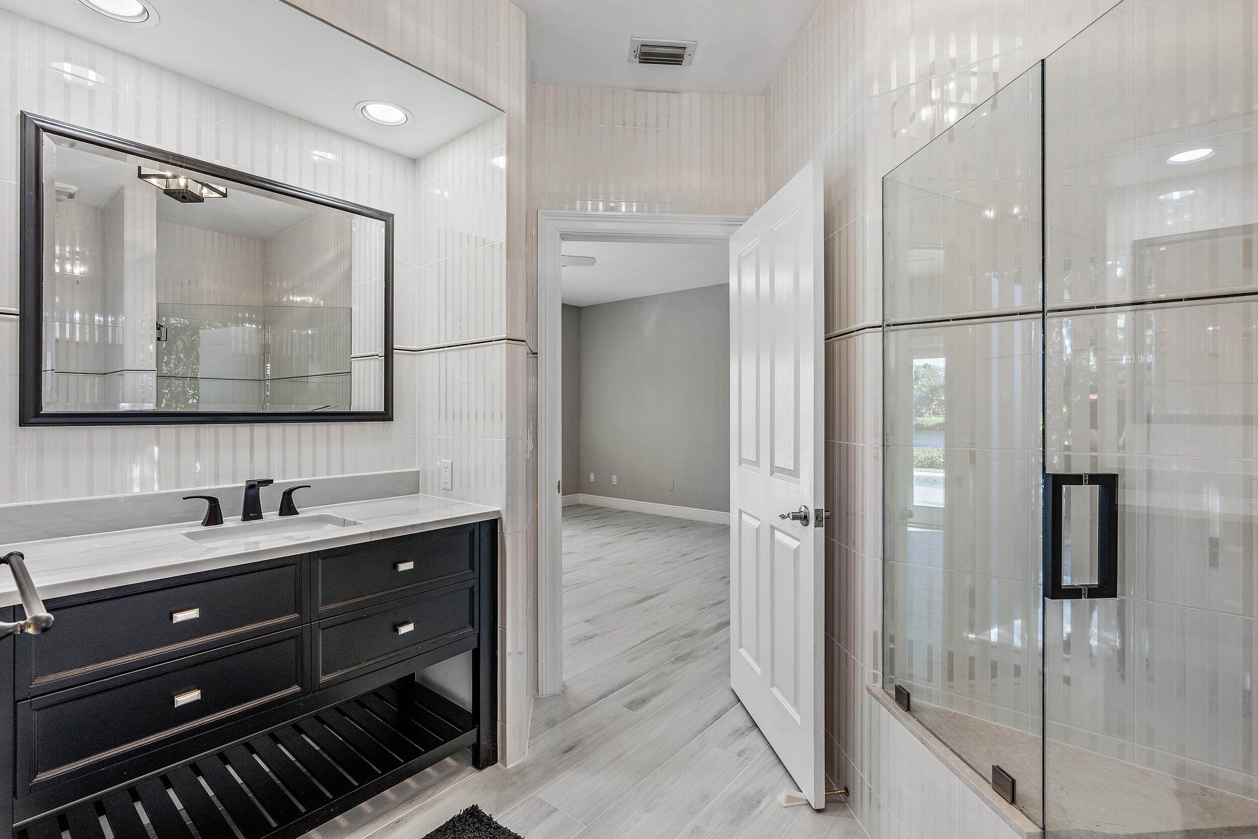 18169 Southeast Ridgeview Drive Tequesta, FL 33469 - Photo 37 of 58 1st Floor Primary EnSuite