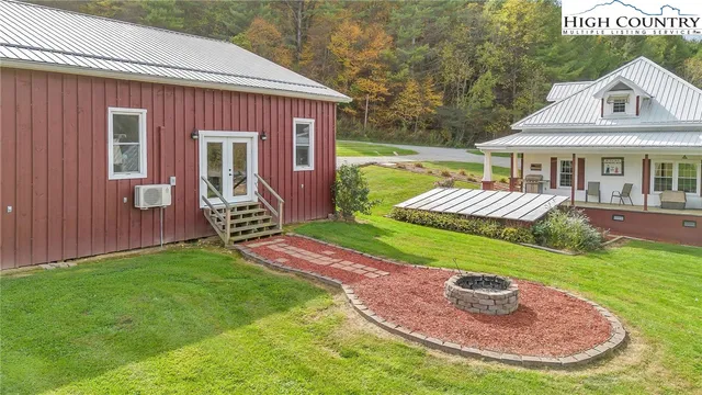 a view of a house with a yard porch and sitting area