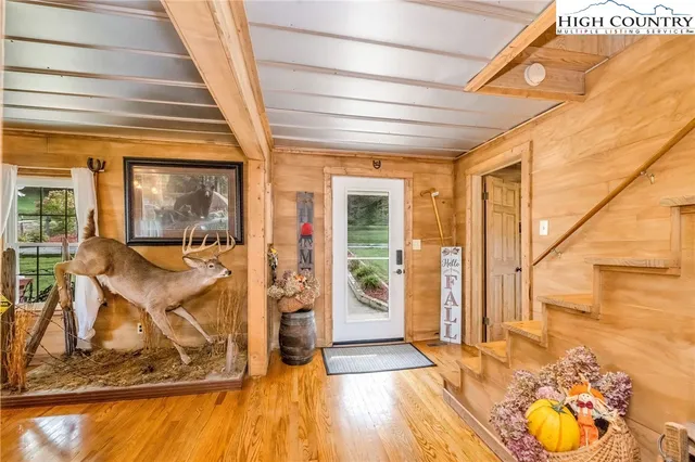 a view of a livingroom with furniture and hardwood floor