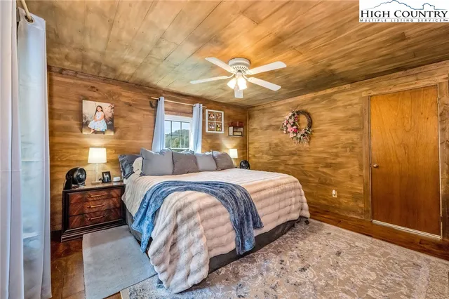 a bedroom with a bed and a view of walk in closet