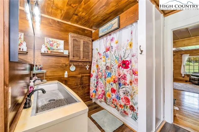 a bedroom with furniture and a chandelier