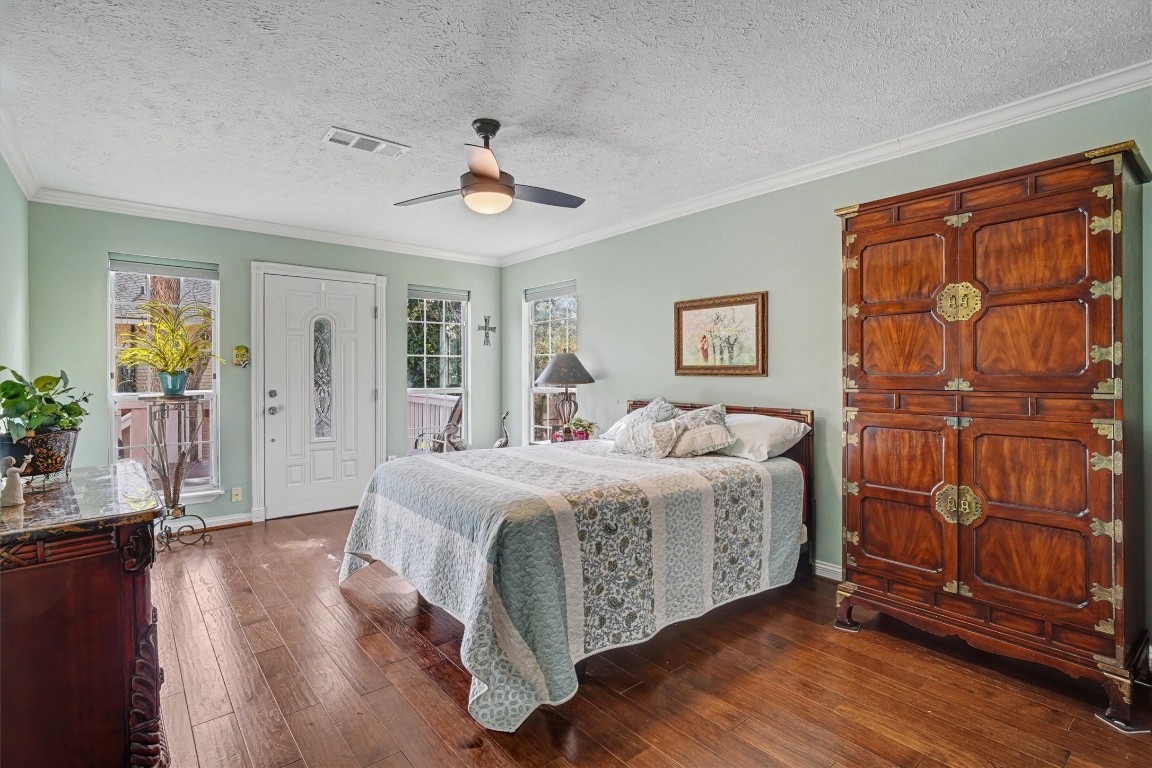 2205 Mission Street Kemah, TX 77565 - Photo 17 of 33 a spacious bedroom with a bed and a window