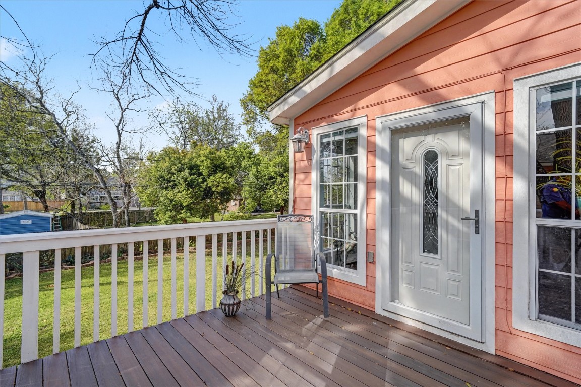 2205 Mission Street Kemah, TX 77565 - Photo 18 of 33 a view of a chair and table on the wooden deck