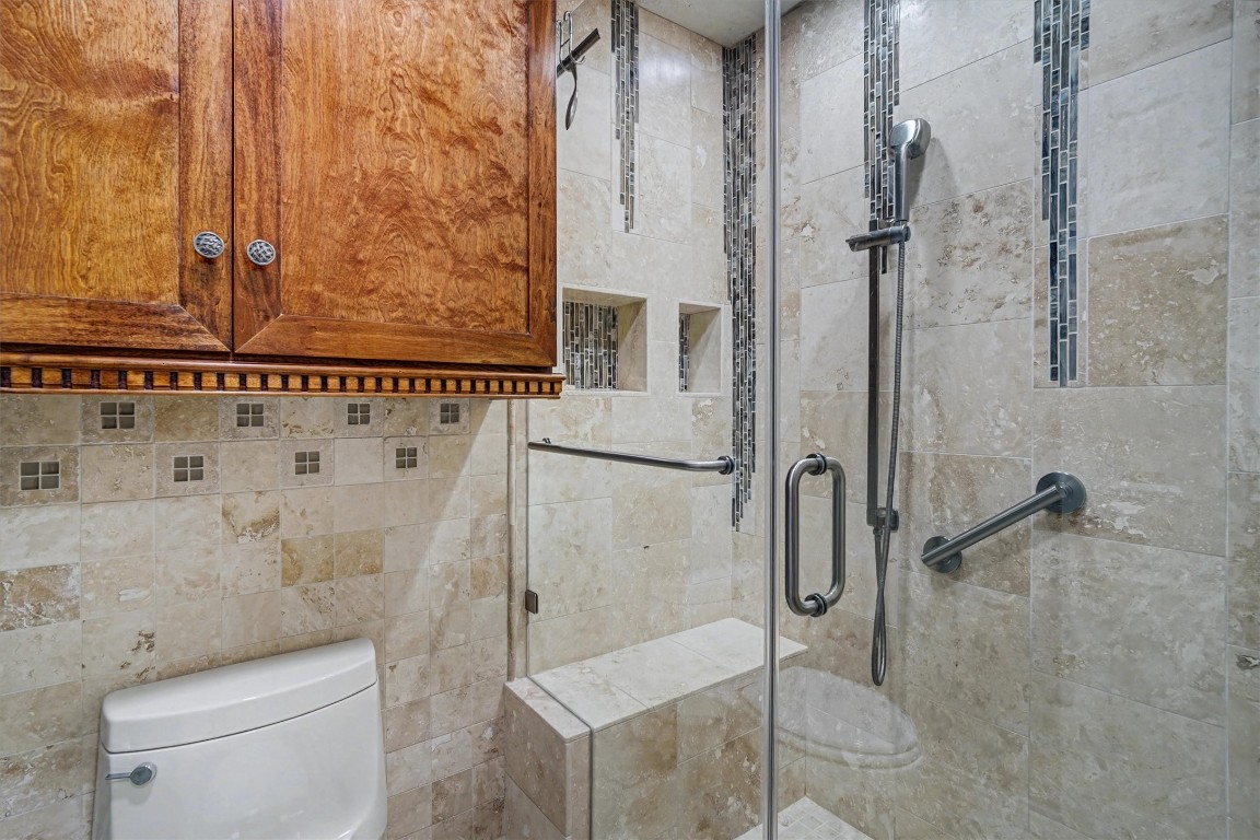 2205 Mission Street Kemah, TX 77565 - Photo 20 of 33 a bathroom with a shower and a toilet