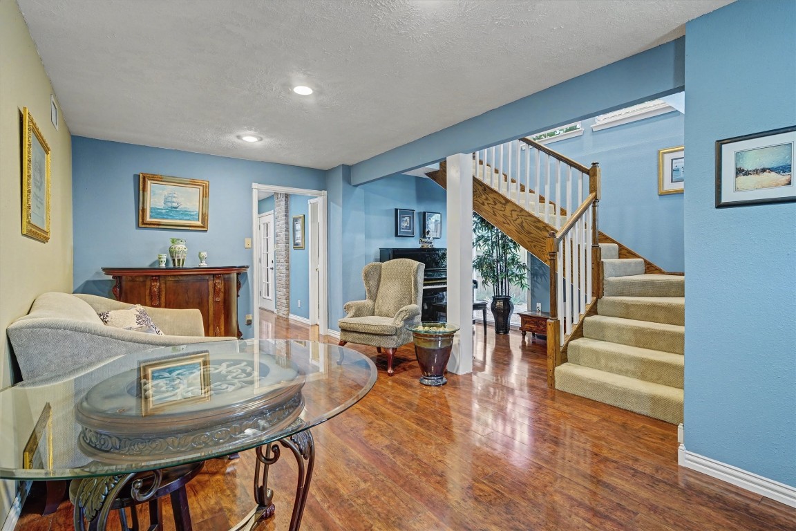 2205 Mission Street Kemah, TX 77565 - Photo 22 of 33 a living room with furniture and a wooden floor