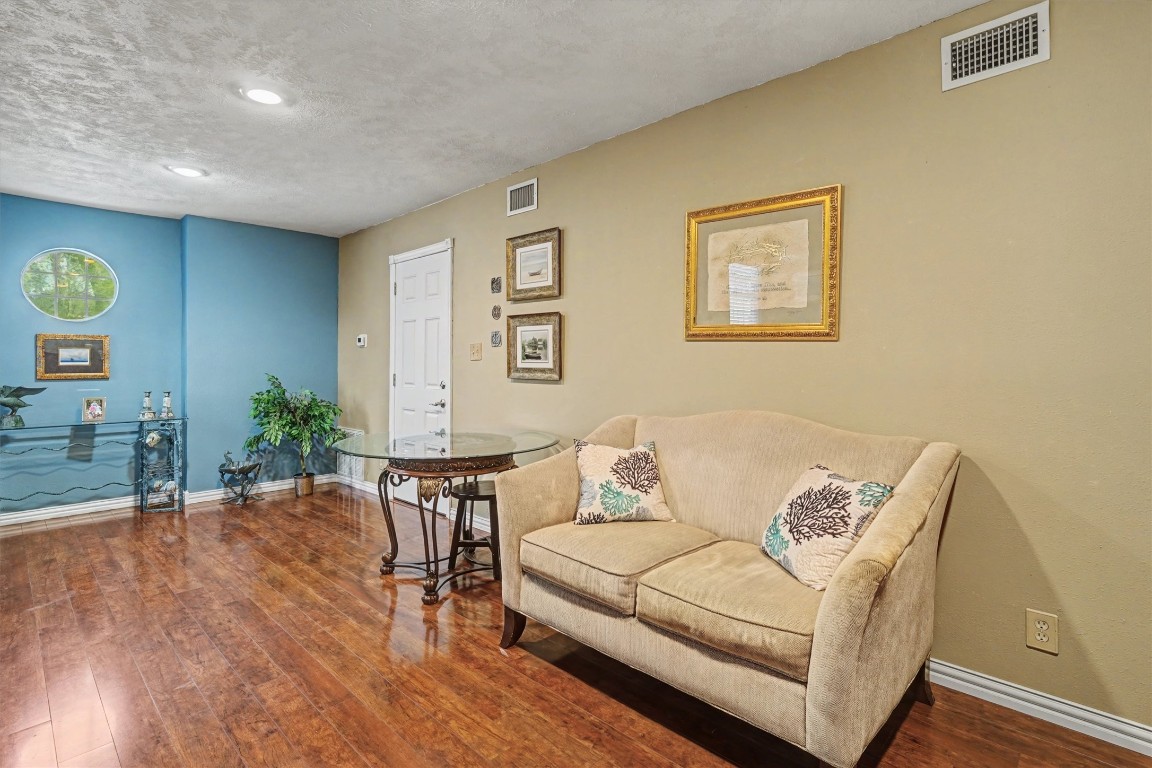 2205 Mission Street Kemah, TX 77565 - Photo 24 of 33 a living room with furniture and wooden floor