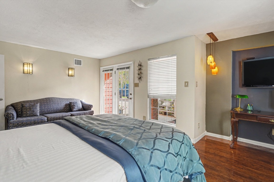 2205 Mission Street Kemah, TX 77565 - Photo 10 of 33 a bedroom with a bed and a flat screen tv