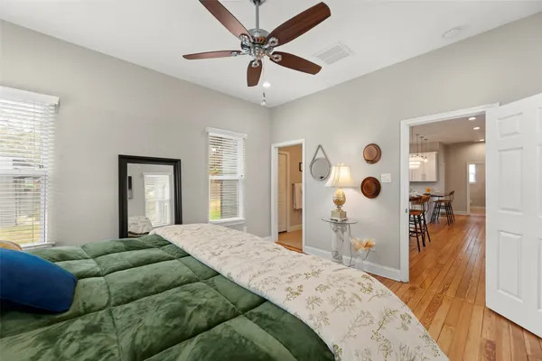 a bed room with a bed window and a television