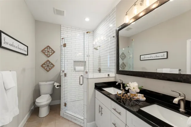 a front view of house with yard and trees