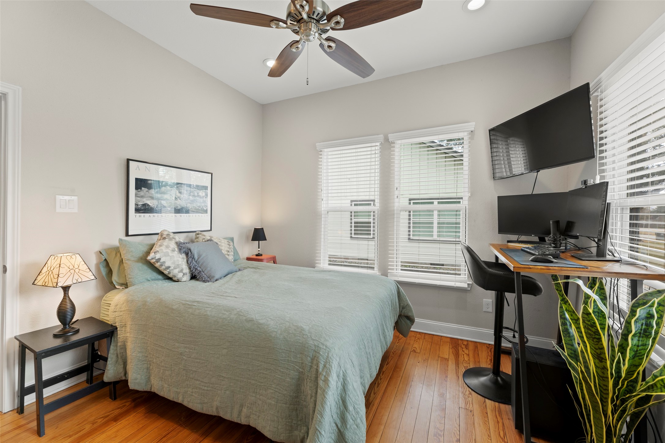711 4th Street Sealy, TX 77474 - Photo 25 of 37 a bedroom with a bed and a flat screen tv