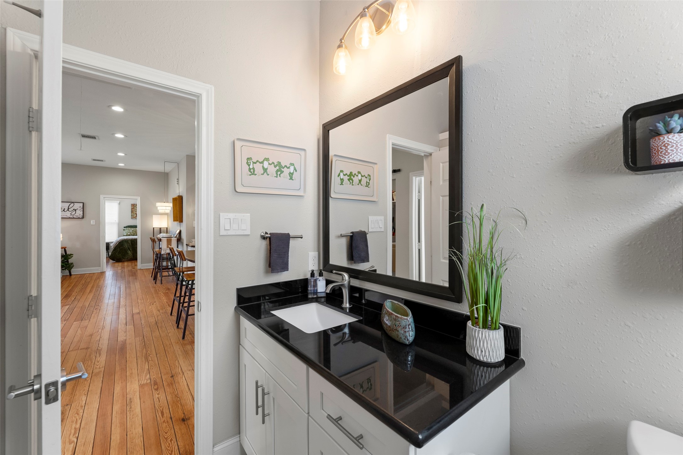 711 4th Street Sealy, TX 77474 - Photo 26 of 37 a bathroom with sink and mirror