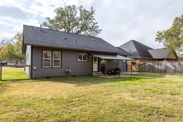 a view of a house with pool porch and chairs